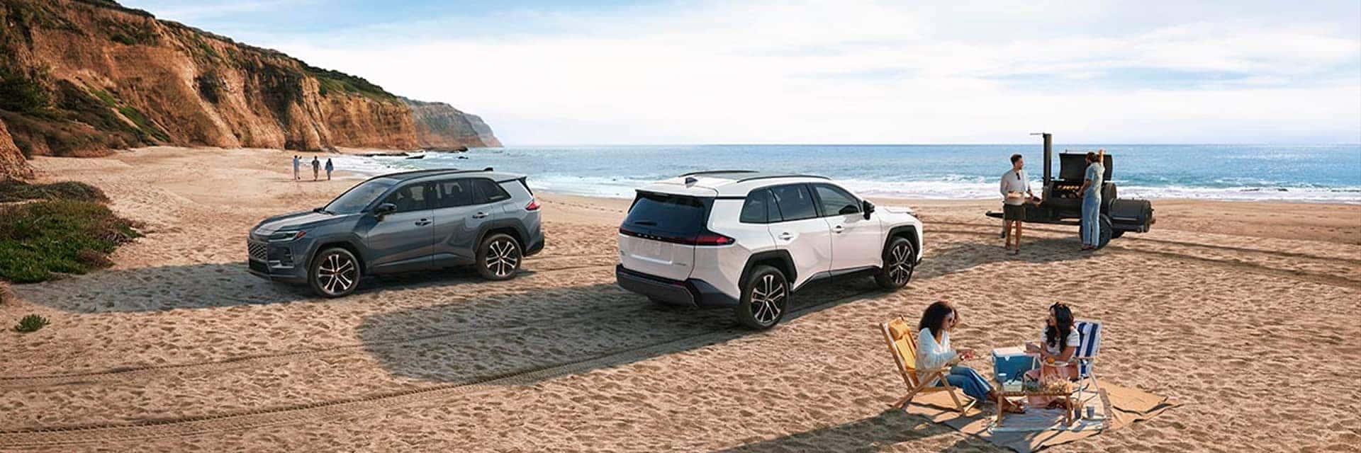 toyota rav parked on beach with people