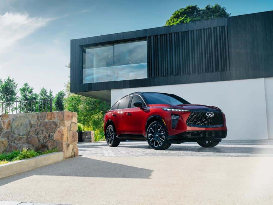 All-new 2027 INFINITI QX65 | Photo Courtesy: INFINITI Red 2027 INFINITI QX65 parked outside home somewhere warm