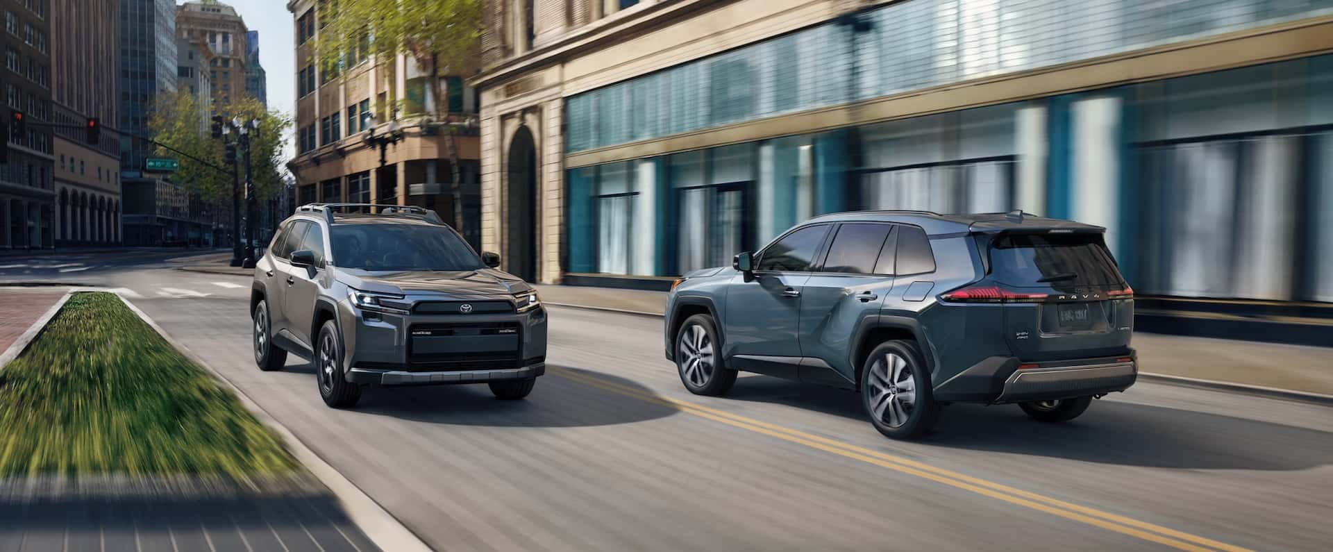 Blue and gray new 2026 Toyota RAV4 on a city road in Metairie, LA