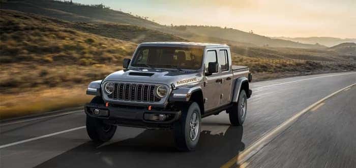 Gray Jeep Gladiator driving on the street