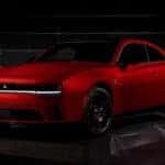 Red Dodge Charger parked in garage