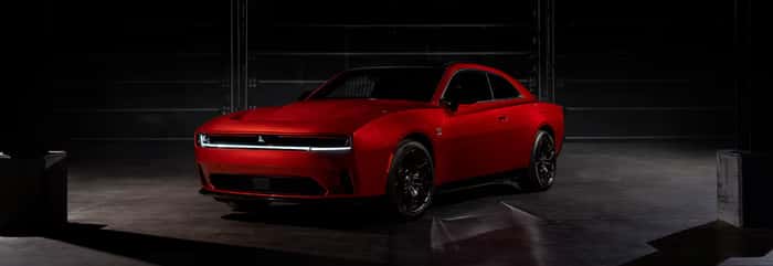 Red Dodge Charger parked in garage