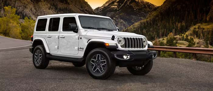 White Jeep Wrangler parked on the road