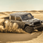 2025 Jeep Gladiator Mojave driving in the sand