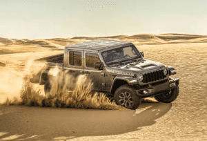 2025 Jeep Gladiator Mojave driving in the sand