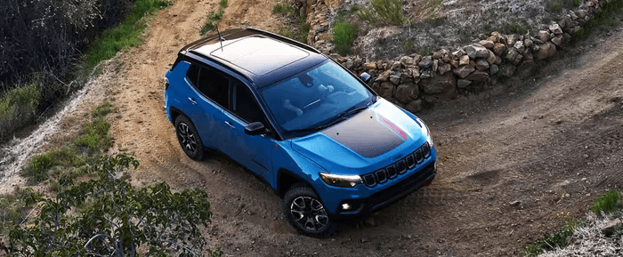 2025 Jeep Compass driving on trail
