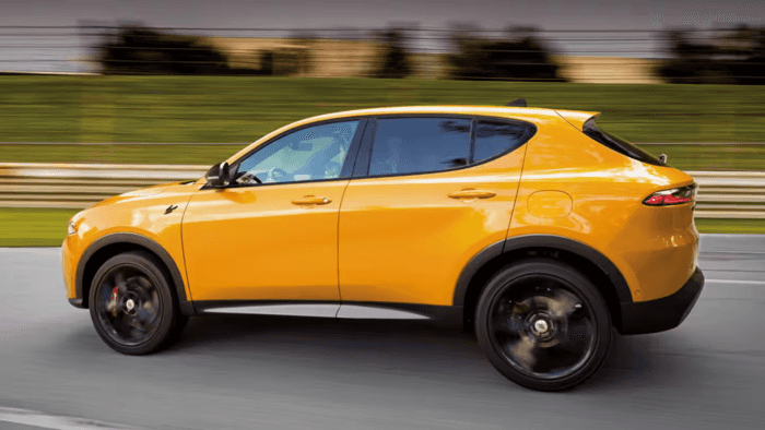 Yellow 2025 Dodge Hornet driving on track