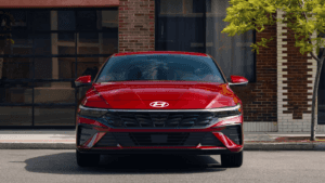 A parked, red 2025 Hyundai Elantra