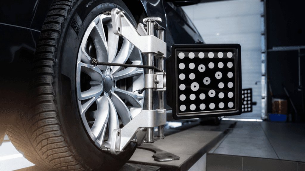 A wheel alignment being performed on a vehicle