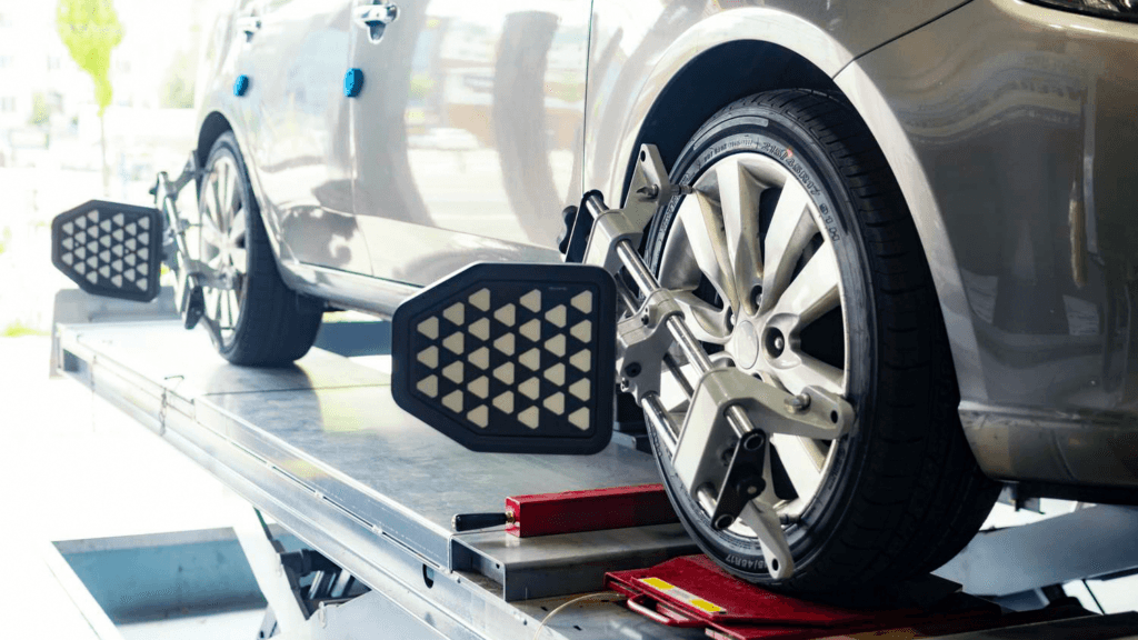 A wheel alignment being performed on a car