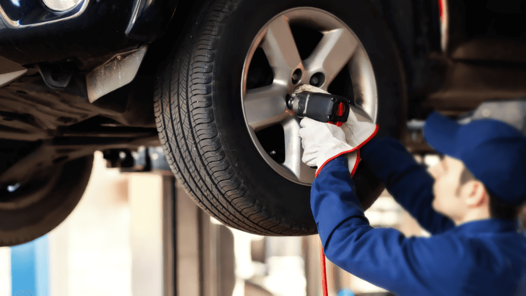 A technician performing routine tire maintenance