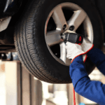 A technician performing routine tire maintenance
