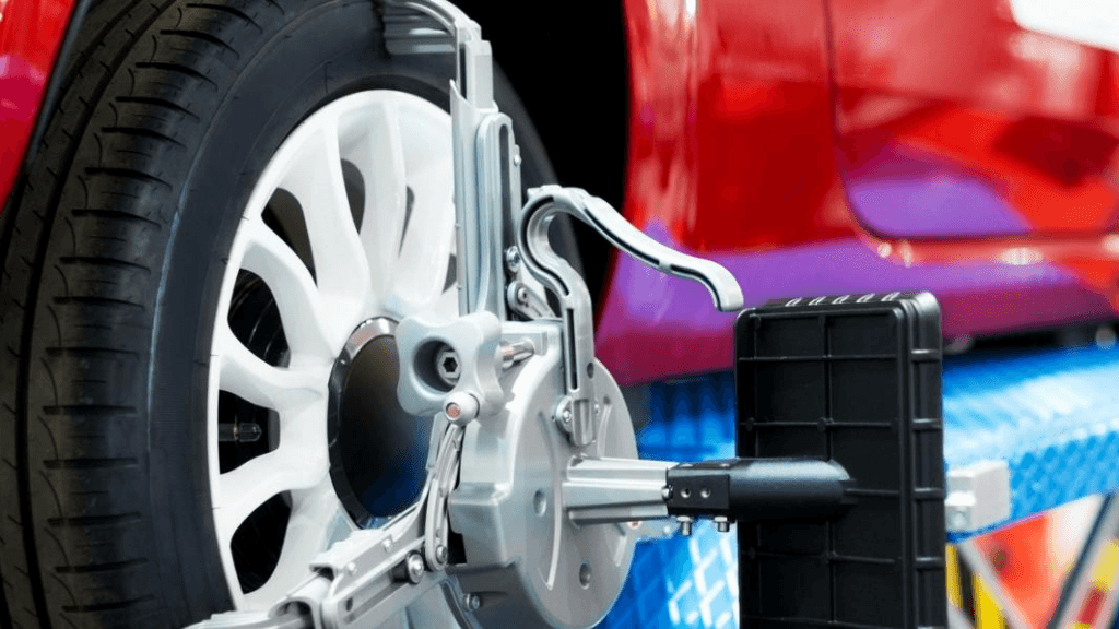 A vehicle getting a wheel alignment