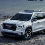 White GMC Acadia SUV Beach Water