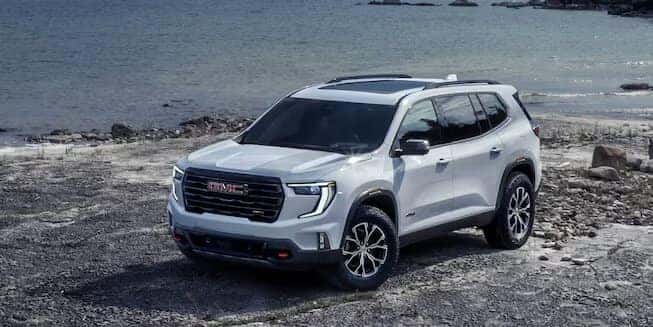 White GMC Acadia SUV Beach Water