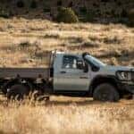 Blue GMC Sierra 2500 HD Pickup Truck Brown Grass