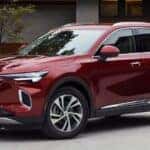 Red Buick Envision SUV Trees