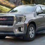 Gray GMC Yukon SUV Green Grass