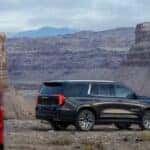 Black and Silver GMC Yukon SUVs