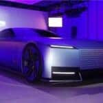 Futuristic concept car displayed under purple and blue lighting, featuring a sleek, aerodynamic design with sharp LED headlights, large wheels, and a smooth metallic body. A sign in the background reads "copy nothing." Photo taken by Kxthy Van.