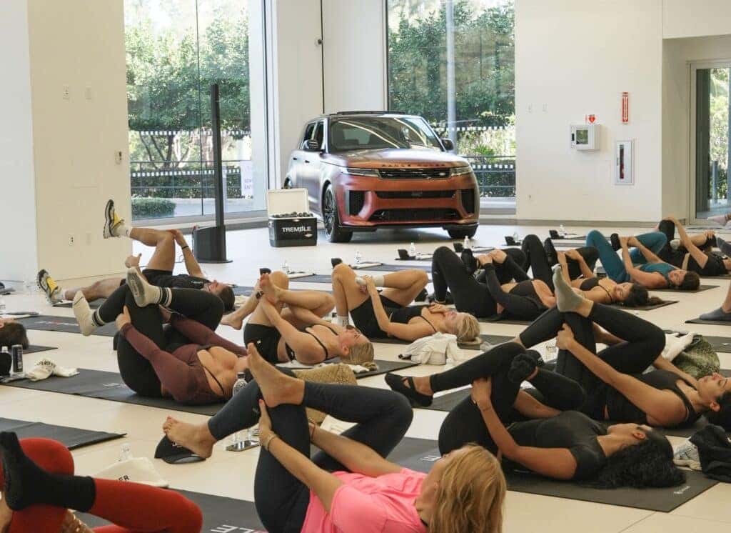 Range Rover Sport on display alongside Tremble Rose and lemon sparkling water at a Pilates class hosted by Land Rover North Dade in its North Miami showroom.