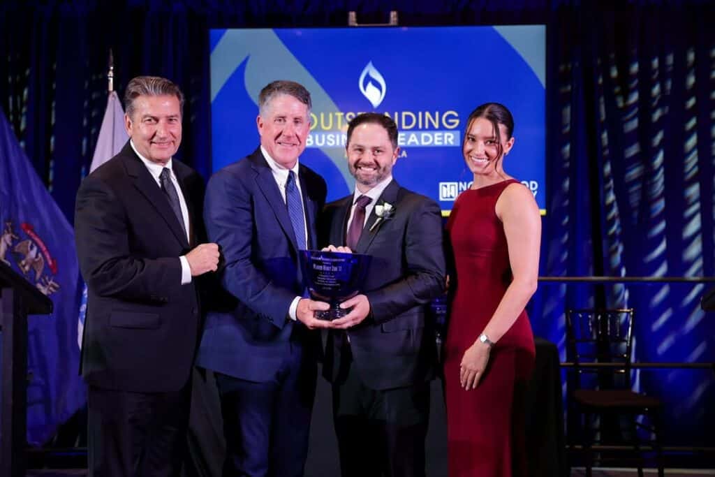 Pictured from left: Outstanding Business Leader Awards Emcee Steve Madincea, Northwood University President Kent MacDonald, Larry Zinn ‘08, and Bella Smylie. Larry accepted the award on behalf of his father, Warren Henry Zinn ’77.