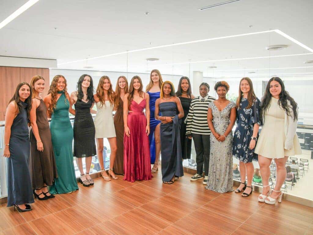 Group photo of female student-athletes at the first-ever Tournament of Champions HER Awards hosted by Warren Henry Auto Group headquarters in North Miami, Florida. The HER Awards celebrate outstanding high school athletes from South Florida, recognizing achievements in athletics, leadership, community involvement, and academic excellence across multiple sports.