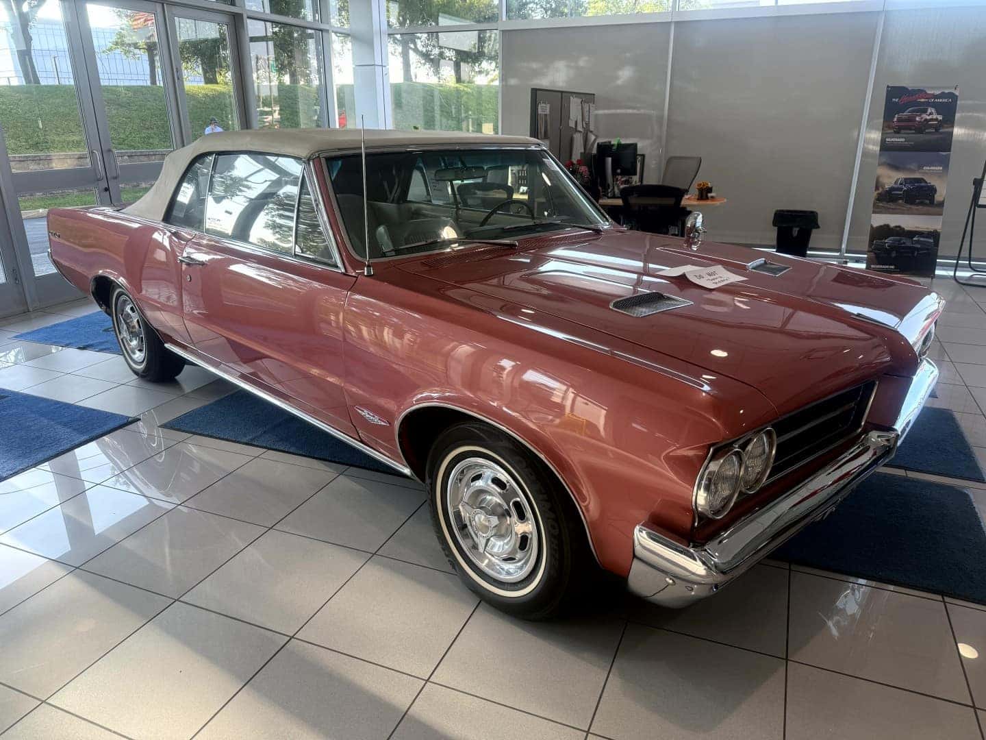 Firemist Red 1964 Pontiac LeMans GTO for sale at Weber Chevrolet Creve Coeur near St. Louis